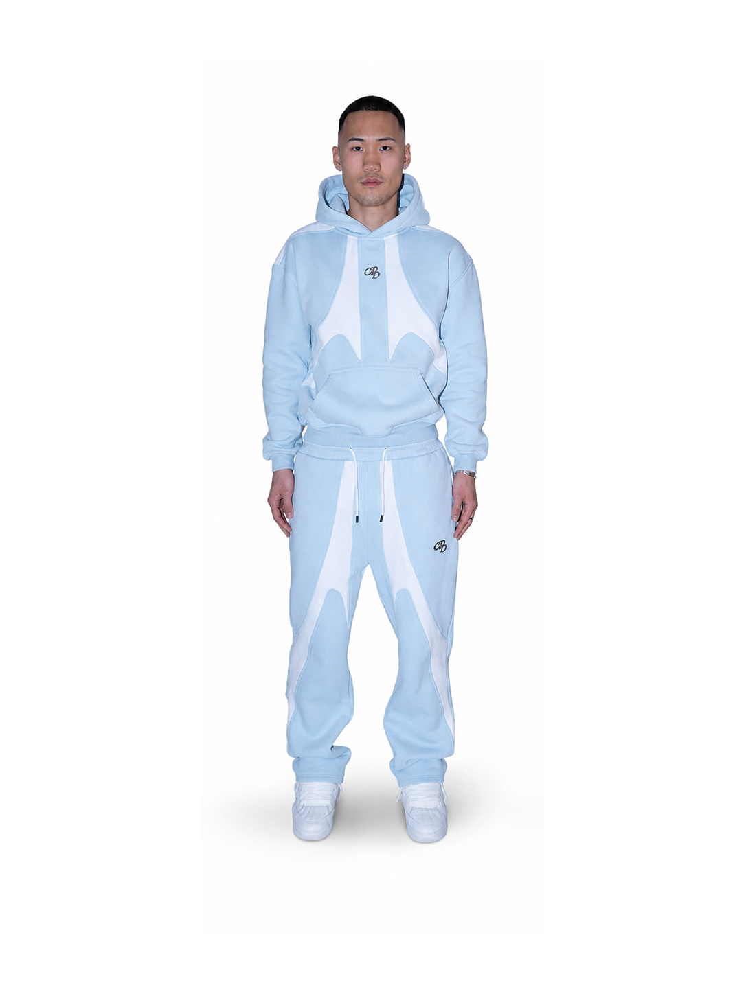 Baby-Open-Leg-Jogger von COMME PAS DE DEUX in Blau, weiche Baumwollhose mit lockerer Passform und elastischem Bund.