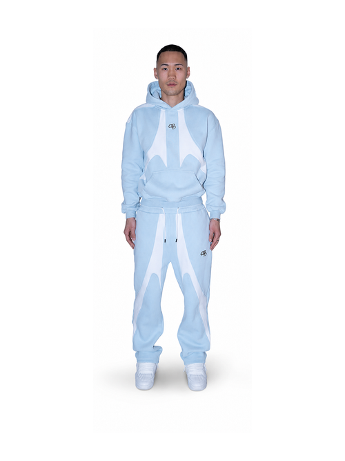 Baby-Open-Leg-Jogger von COMME PAS DE DEUX in Blau, weiche Baumwollhose mit lockerer Passform und elastischem Bund.