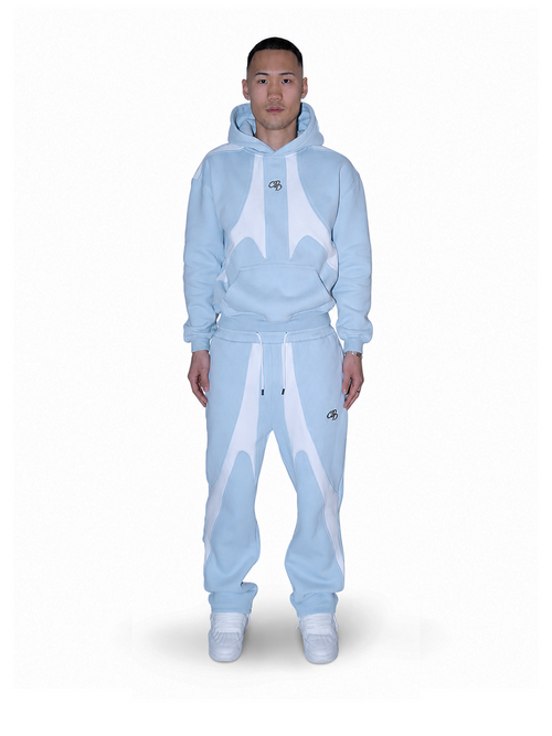 Baby-Jogger mit offener Beinöffnung in Blau von COMME PAS DEUX, vorne sichtbar, bequemes und stylisches Design